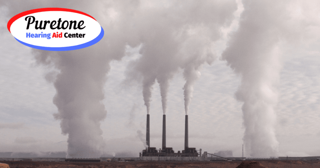 smokestacks against a bleak landscape