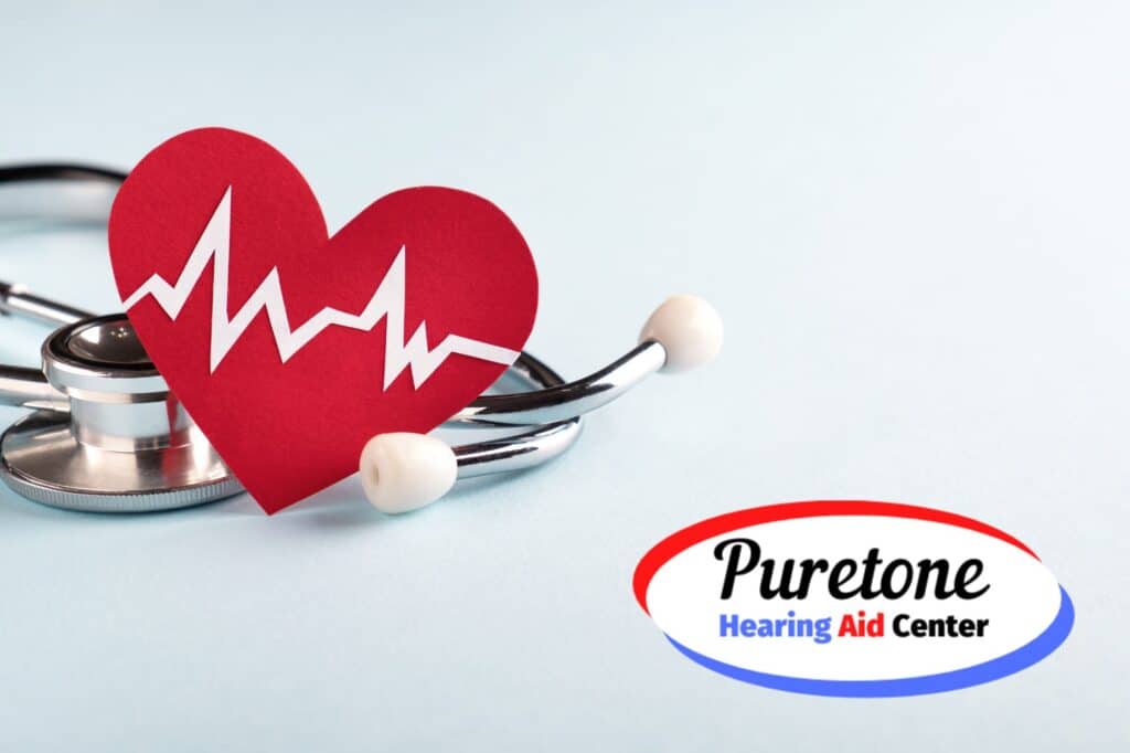 a stethoscope and a cardboard cutout of a heart