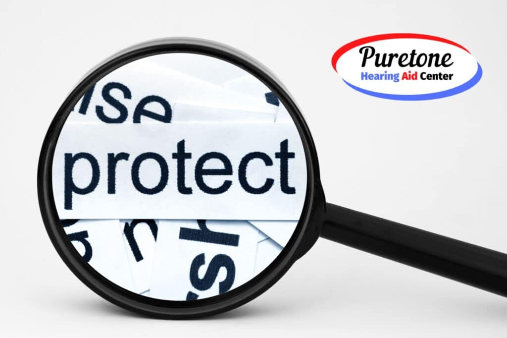 a magnifying glass showing the word protect